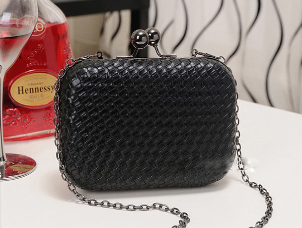 black woven clutch